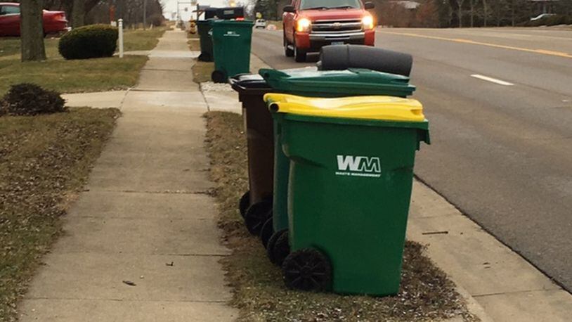 Thousands of Waste Management Inc.’s containers were left with former customers in Miami Twp. after the trash hauler’s contract expired at the end of 2017. The issue created a “disaster,” one township official said, resulting in new contractor Rumpke of Ohio obtaining a waiver from WMI to collect the bins. NICK BLIZZARD/STAFF