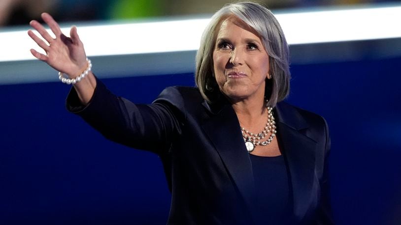 New Mexico Gov. Michelle Lujan Grisham waves during the Democratic National Convention Tuesday, Aug. 20, 2024, in Chicago. (AP Photo/Charles Rex Arbogast)