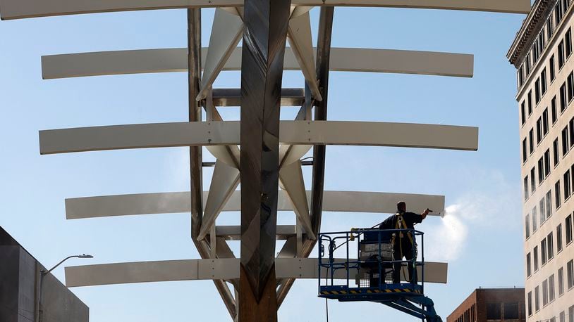 The Wright brothers "Flyover" sculpture/site on South Main Street in downtown Dayton is being restored. Phase 1 for 2024 includes general cleaning of the sculpture, replacing the current, non-operable lighting to LED fixtures, adding a landscape plan and repair/replace irrigation system for long-term care, and install new plaques that tell the history and feature the project partners/sponsors. MARSHALL GORBY\STAFF