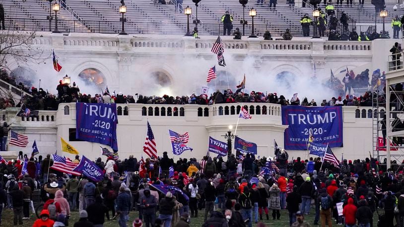 FILE - Violent protesters, loyal to President Donald Trump, storm the Capitol, Wednesday, Jan. 6, 2021, in Washington. (AP Photo/John Minchillo, File)