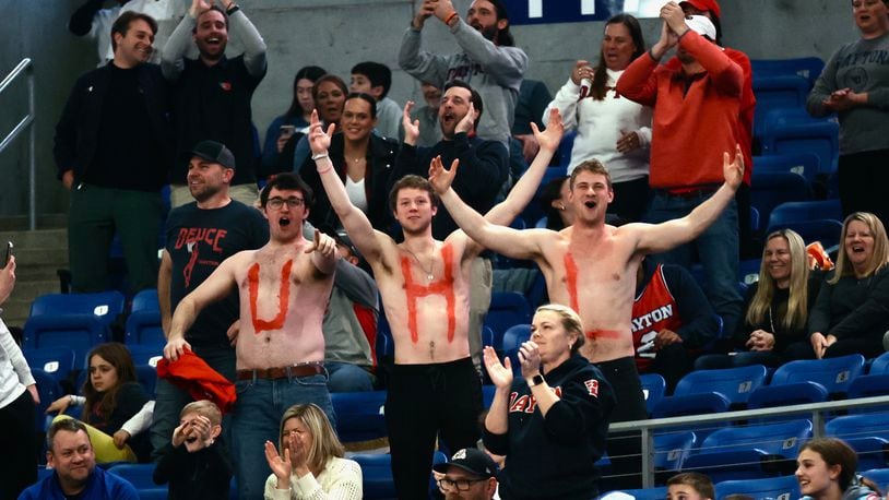 Friends of Dayton's Brady Uhl show off their painted chests during a game against Saint Louis on Tuesday, March 5, 2024, at Chaifetz Arena in St. Louis, Mo. David Jablonski/Staff