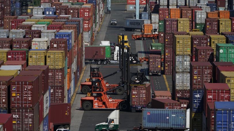 FILE - Containers are moved at the Port of New York and New Jersey in Elizabeth, N.J., on June 30, 2021. (AP Photo/Seth Wenig, File)