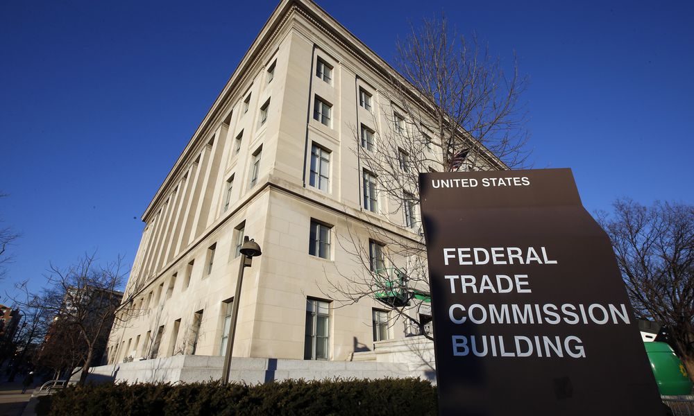 FILE - A sign stands outside the Federal Trade Commission building, Jan. 28, 2015, in Washington. (AP Photo/Alex Brandon, File)