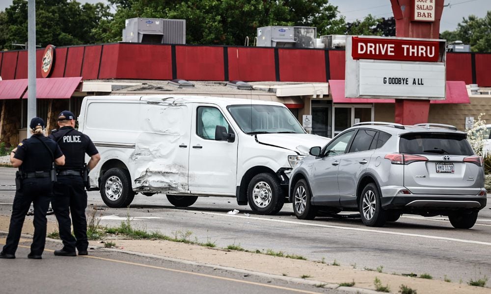 A police pursuit involving a stolen car that fled from police Friday afternoon, June 23, 2023, ended in a three-vehicle injury crash at North Springboro Pike and South Dixie Avenue in Moraine. JIM NOELKER/STAFF