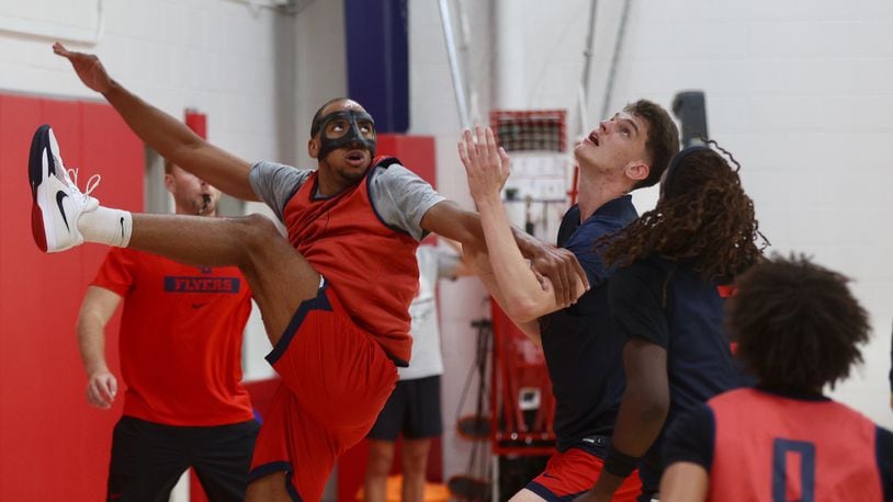 Dayton's Zed Key, left, and Amaël L'Etang battle for a rebound during a preseason practice on Wednesday, Oct. 2, 2024, at the Cronin Center. David Jablonski/Staff