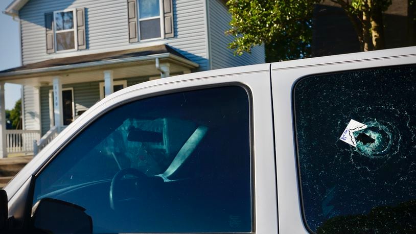 Multiple people were taken to the hospital following a shooting in Dayton on Home Avenue near South Euclid Avenue early Monday, June 24, 2024. Several vehicles, including this truck, have bullet holes from the shooting. MARSHALL GORBY \STAFF
