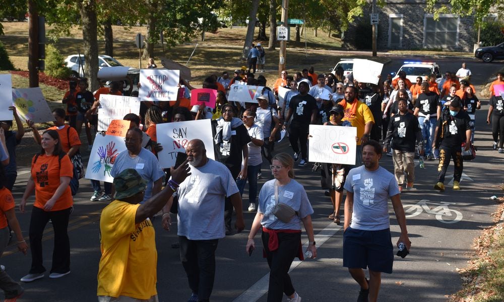 Kids, teens and adults marched down Broadway Street in northwest Dayton on Thursday, Sept. 19, 2024, as part of a peace march and rally in response to an increase in gun violence in the community. CORNELIUS FROLIK / STAFF