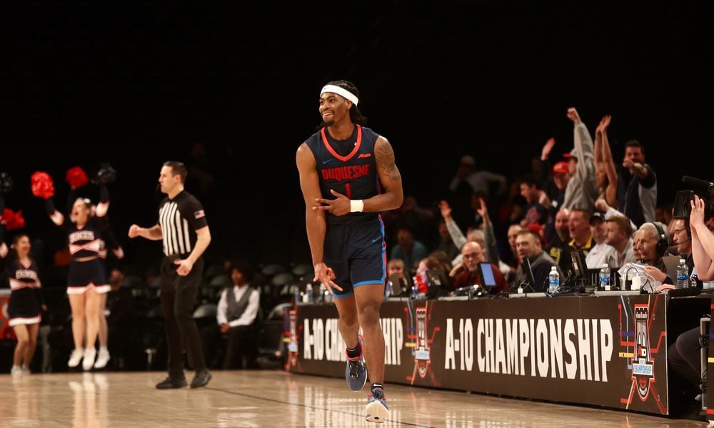 Duquesne's Jimmy Clark III celebrates after making a 3-pointer against Dayton in the final minutes in the Atlantic 10 Conference tournament quarterfinals on Thursday, March 14, 2024, at the Barclays Center in Brooklyn, N.Y. David Jablonski/Staff