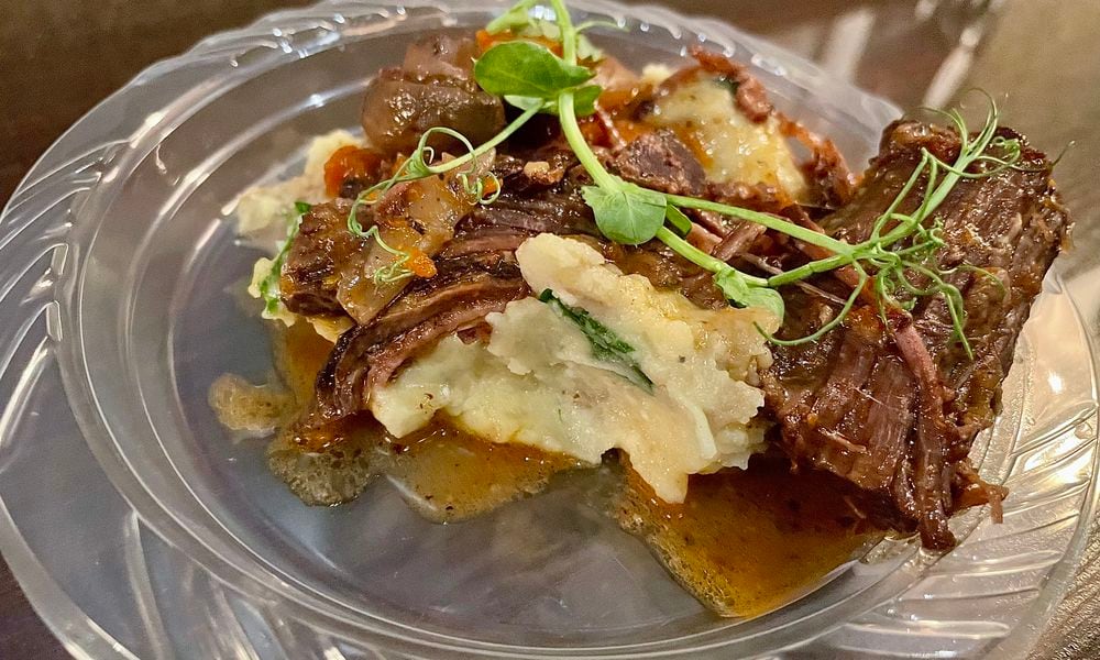 The Miami Valley Restaurant Association’s Sneak Peek to Winter Restaurant Week at The Steam Plant in Dayton featured 12 establishments serving unique dishes for foodies to try. Pictured is Beef Bourguignon and Mashed Potatoes from Manna in Centerville. NATALIE JONES/STAFF