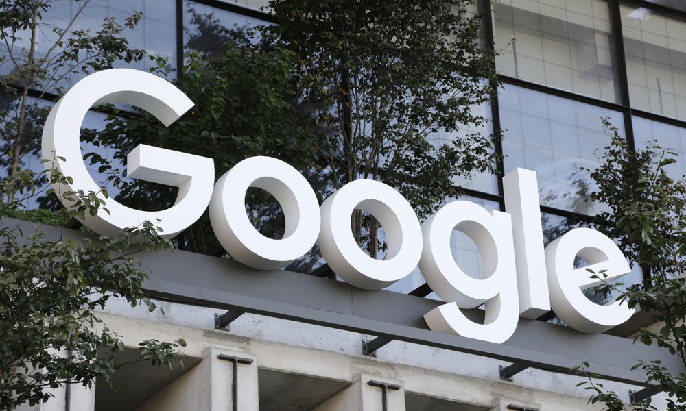 FILE - A Google sign hangs over an entrance to the company's new building, Sept. 6, 2023, in New York. (AP Photo/Peter Morgan, File)