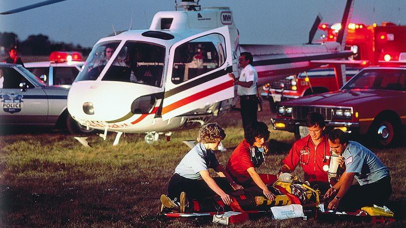 Candy Skidmore and other members of CareFlight respond to the scene of an accident in 1983, when the CareFlight program began. Skidmore has been with CareFlight since its inception, starting as a flight nurse before becoming an administrator of the program. Skidmore has also been Premier Health’s vice president of emergency and trauma services for over the last decade. COURTESY OF PREMIER HEALTH