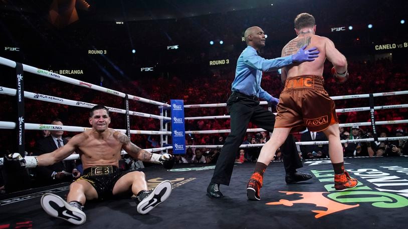 Canelo Alvarez knocks down Edgar Berlanga in a super middleweight title bout Saturday, Sept. 14, 2024, in Las Vegas. (AP Photo/John Locher)