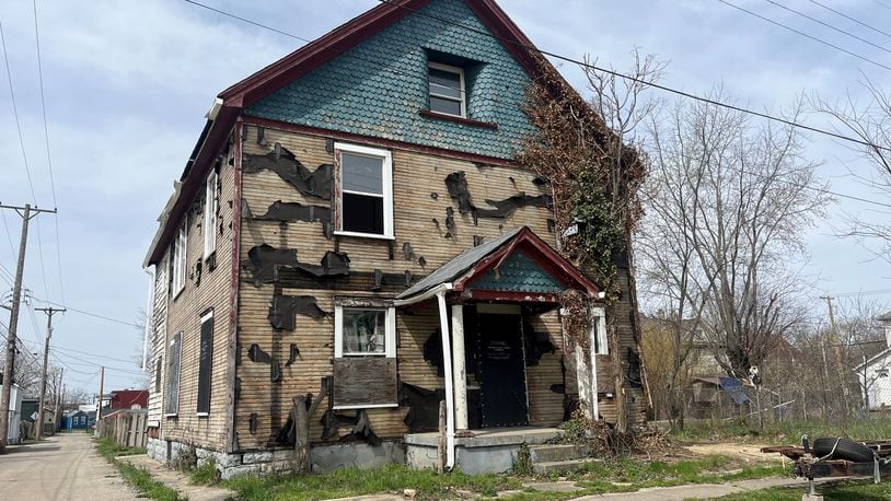 A vacant and deteriorating home in East Dayton. CORNELIUS FROLIK / STAFF