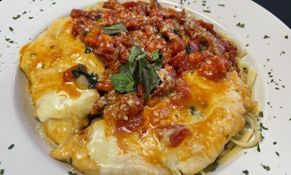 Jimmy’s Italian Cuisine & Bar is opening its doors in downtown Dayton at 824 E. Fifth St. on Wednesday, May 1. Pictured is the Chicken Salerno. NATALIE JONES/STAFF