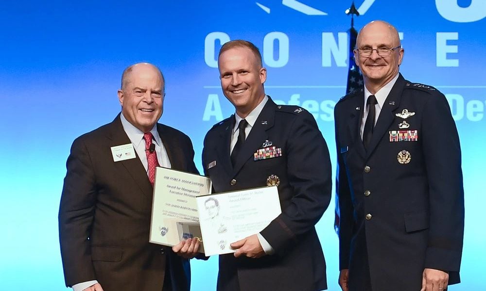 Then-Col. Jason Bartolomei, center, receives the Air Force Materiels Command Management and Gen. Larry D. Welch Award-Executive Division during the Air Force Association Air, Space and Cyber Conference in National Harbor, Md., in September 2019. U.S. Air Force photo by Andy Morataya.