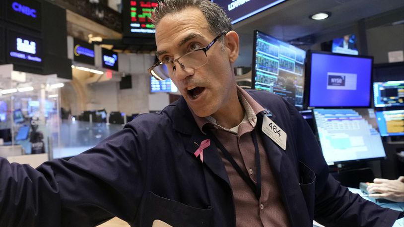 Trader Gregory Rowe works on the floor of the New York Stock Exchange, Friday, Aug. 16, 2024. (AP Photo/Richard Drew)