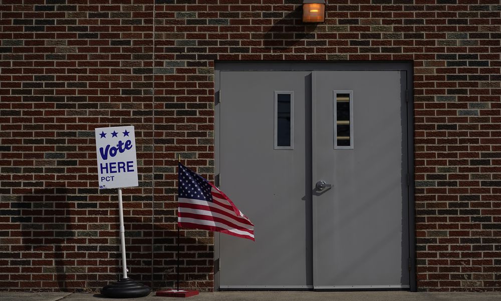 The door of the Jeffersonville Masonic Lodge polling location is marked with an American Flag and a 