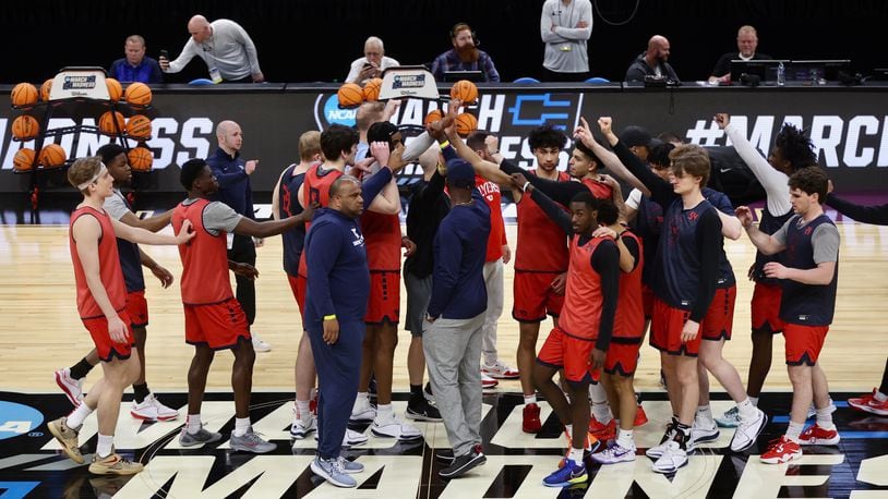 Dayton huddles during practice for the NCAA tournament at the Delta Center in Salt Lake City, Utah, on Wednesday, March 20, 2024. David Jablonski/Staff