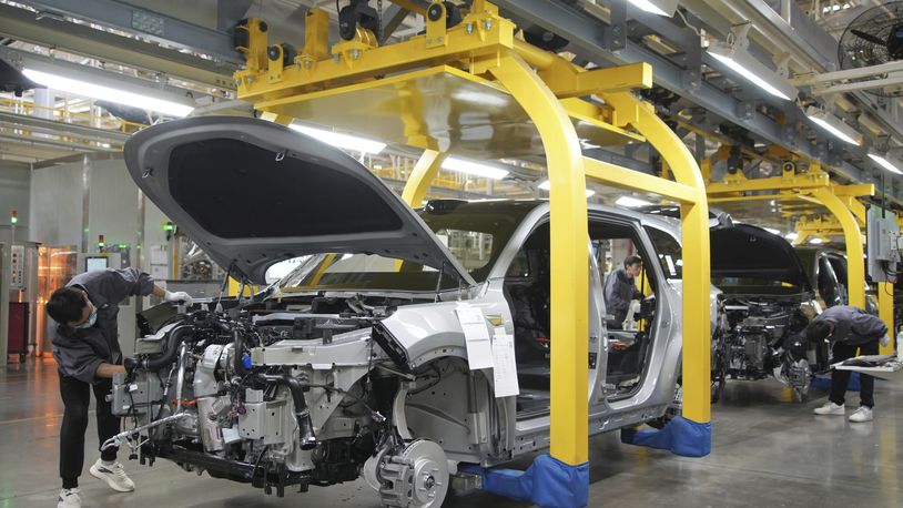 FILE - A worker assembles an SUV at a car plant of Li Auto, a major Chinese EV maker, in Changzhou in eastern China's Jiangsu province, March 27, 2024. (Chinatopix Via AP, File)