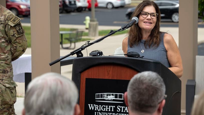 Tricia English, widow of Capt. Shawn English, speaks during the dedication of the champions garden named in honor of her husband outside the Veteran and Military Center at Wright State University. CHRIS SNYDER/WRIGHT STATE UNIVERSITY