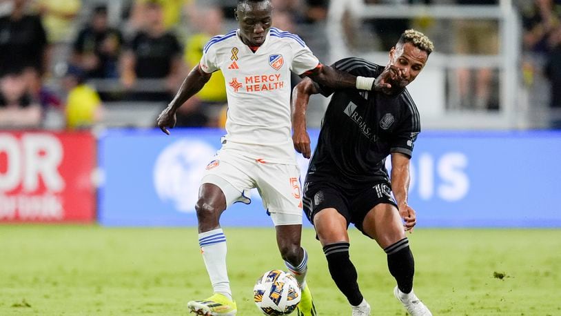 FC Cincinnati midfielder Obinna Nwobodo (5) kicks the ball past Nashville SC midfielder Hany Mukhtar (10) during the second half of an MLS soccer match Saturday, Sept. 21, 2024, in Nashville, Tenn. (AP Photo/George Walker IV)