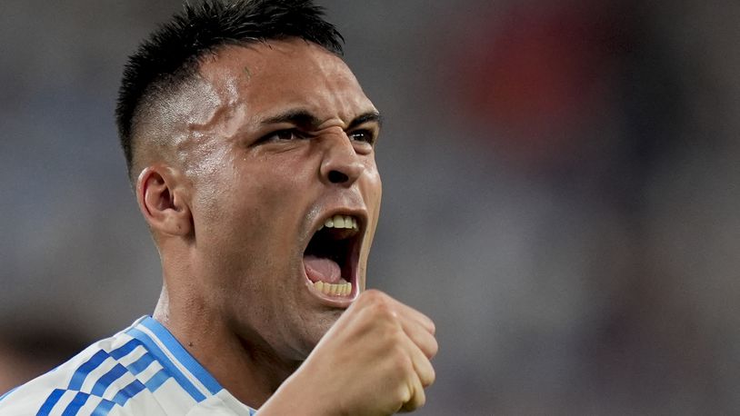 Argentina's Lautaro Martinez celebrates scoring his side's opening goal against Chile during a Copa America Group A soccer match in East Rutherford, N.J., Tuesday, June 25, 2024. (AP Photo/Julia Nikhinson)