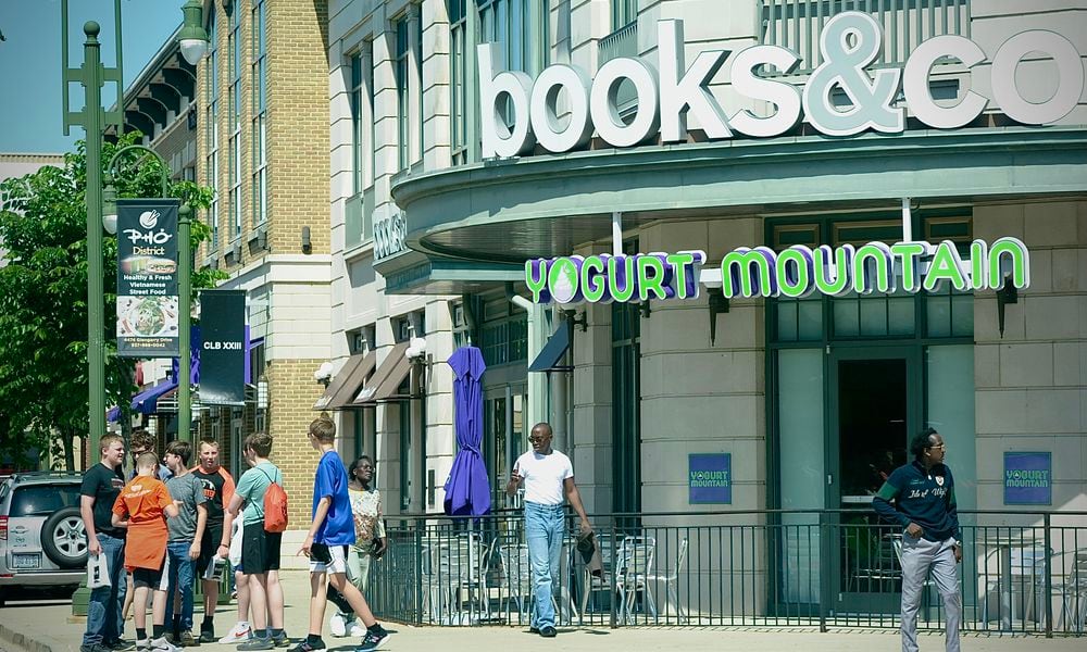 Shoppers walk from store to store at The Greene Town Center in Beavercreek on Tuesday, May 16, 2024. MARSHALL GORBY / STAFF