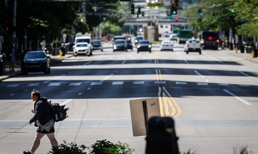 A pedestrian walks across North Main Street at First Street looking south. The city wants to make improvements on North Main Street from Monument Ave. to Sixth Street. JIM NOELKER/STAFF