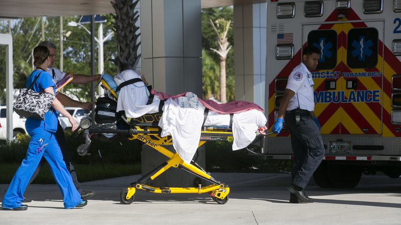 FILE - Patients are evacuated from Palms of Pasadena Hospital in South Pasadena, Fla. on Friday, Sept. 8, 2017, as Hurricane Irma approaches. (Eve Edelheit/Tampa Bay Times via AP, File)