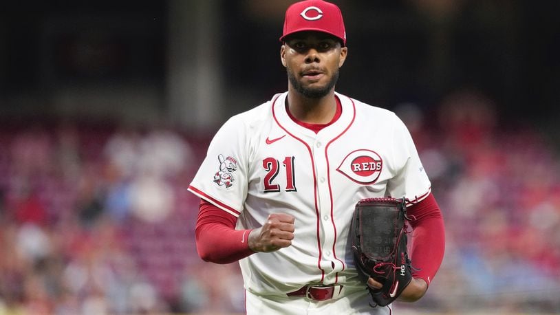 Cincinnati Reds' Hunter Greene pumps his fist after walking off the mound during the seventh inning of a baseball game against the St. Louis Cardinals, Tuesday, Aug. 13, 2024, in Cincinnati. (AP Photo/Kareem Elgazzar)