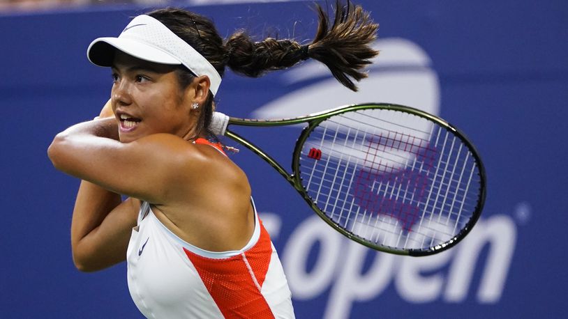 FILE - Emma Raducanu, of Britain, returns a shot to Alize Cornet, of France, during the first round of the US Open tennis championships, Aug. 30, 2022, in New York. (AP Photo/Frank Franklin II, File)