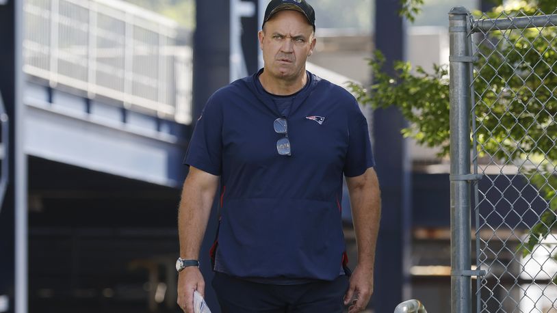 New England Patriots offensive coordinator Bill O'Brien walks onto the field during an NFL football practice, Friday, July 28, 2023, in Foxborough, Mass. (AP Photo/Michael Dwyer)